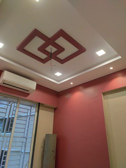 Modern POP ceiling for the main hall with central wood panels