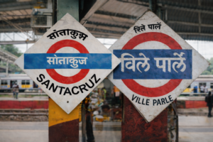 Where is the nearest train station to Juhu Beach?